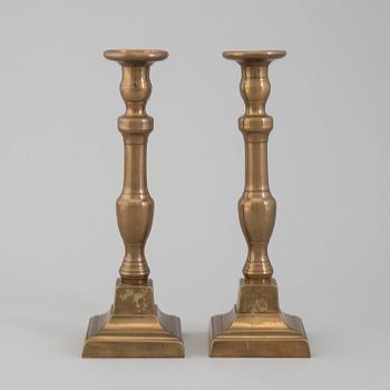 A pair of 19th century bronze candlesticks.