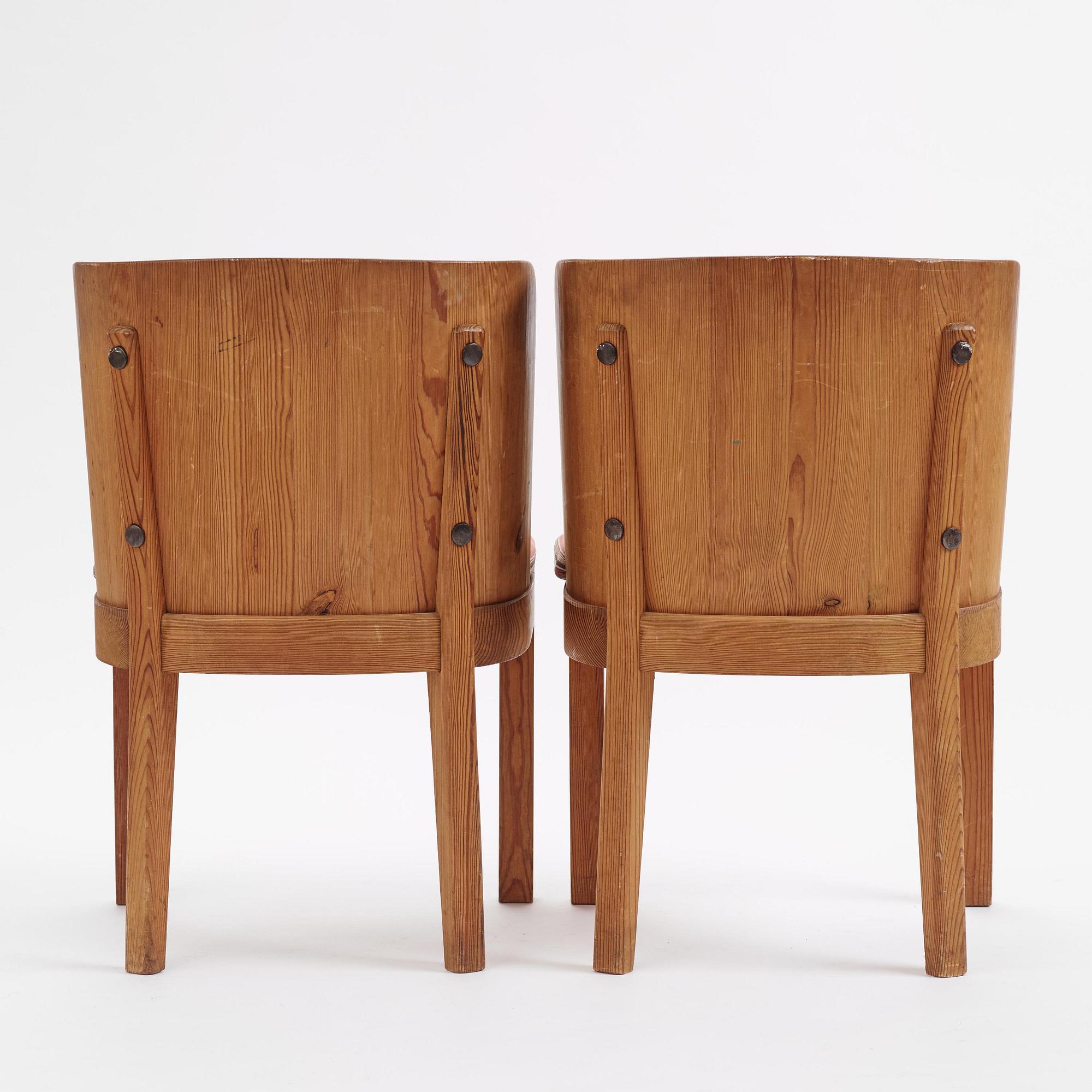 Axel Einar Hjorth, a pair of stained pine "Lovö" armchairs, Nordiska Kompaniet,  Sweden, 1930s.