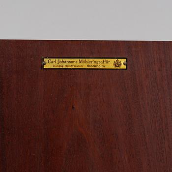 A mahogany bedside cabinet by Carl Johanssons Möbleringsaffär, around the year 1900.