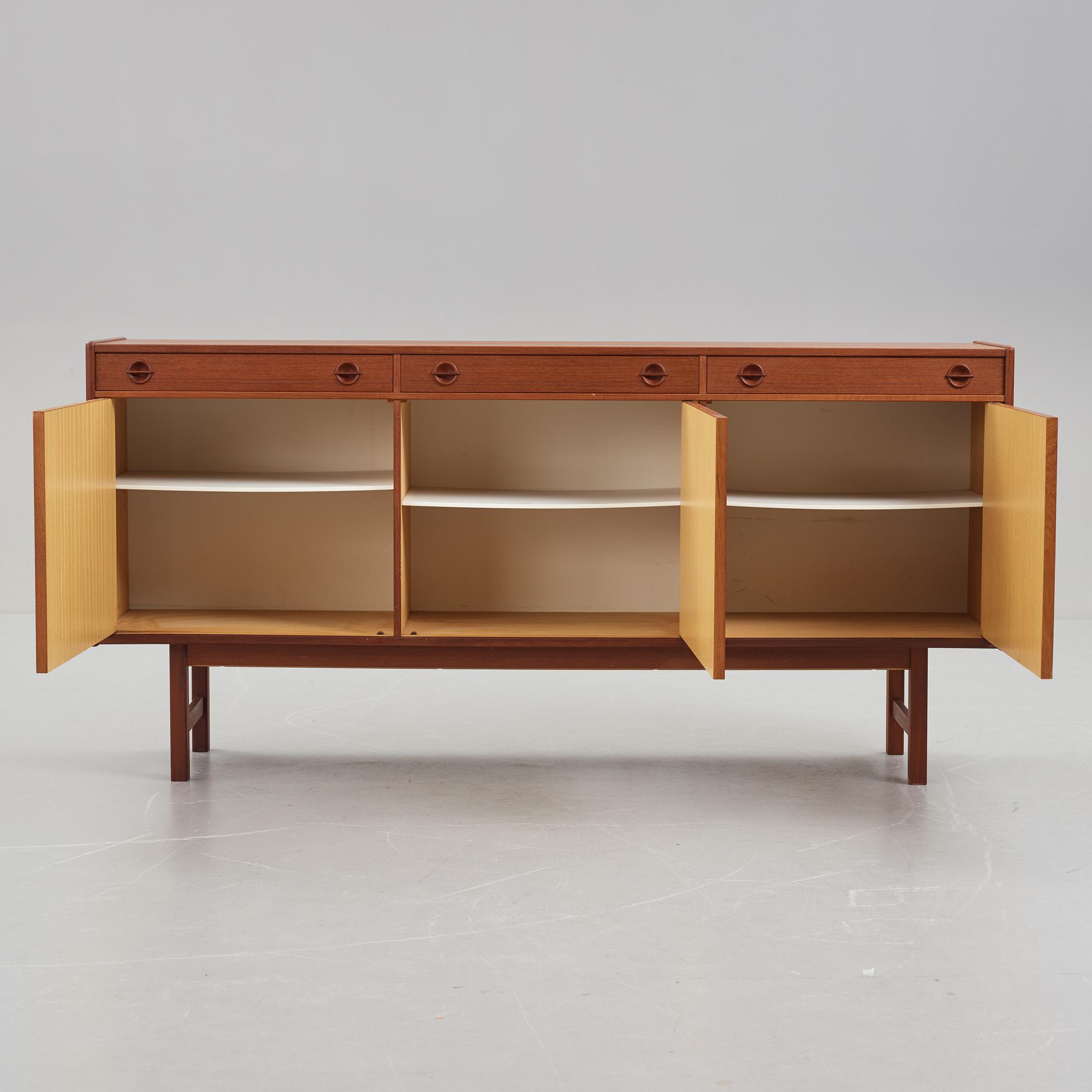 A late 20th Century teak veneered sideboard.