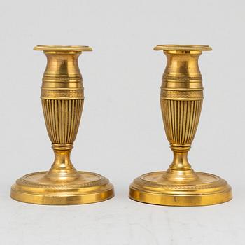 A pair of brass 19th century candlesticks.