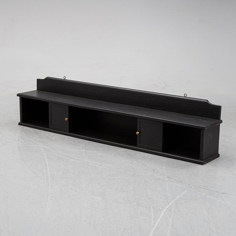 A painted wall shelf, early 20th Century.