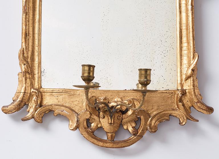 A pair of Danish rococo girandole mirrors.