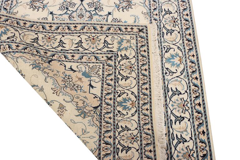 A Nain part silk rug, c. 193 x 148 cm.