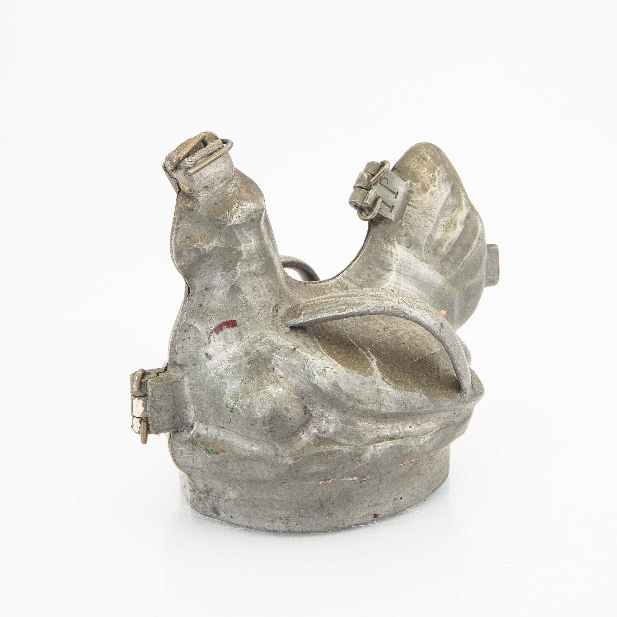 A set of four pewter icecream moulds around 1900.