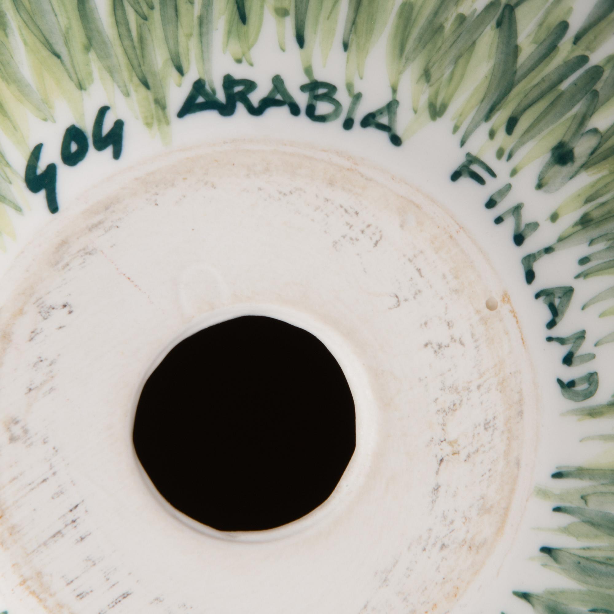 A porcelain egg signed GOG Arabia Finland.
