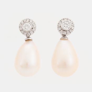 A pair of 18K white gold and cultured pearl earrings set with round brilliant-cut diamonds.