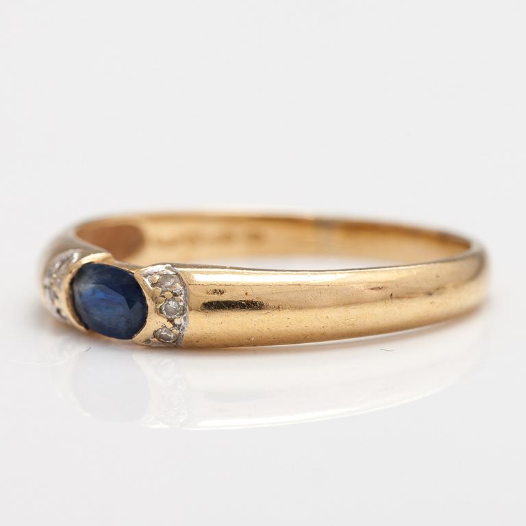 SORMUS, 14K kultaa, safiiri, timantteja n. 0.015 ct yht. Kultakeskus, Hämeenlinna 1999.