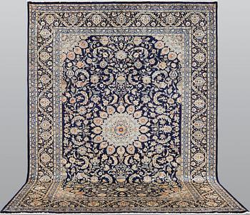 A Kashmar carpet, ca 340 x 253 cm.