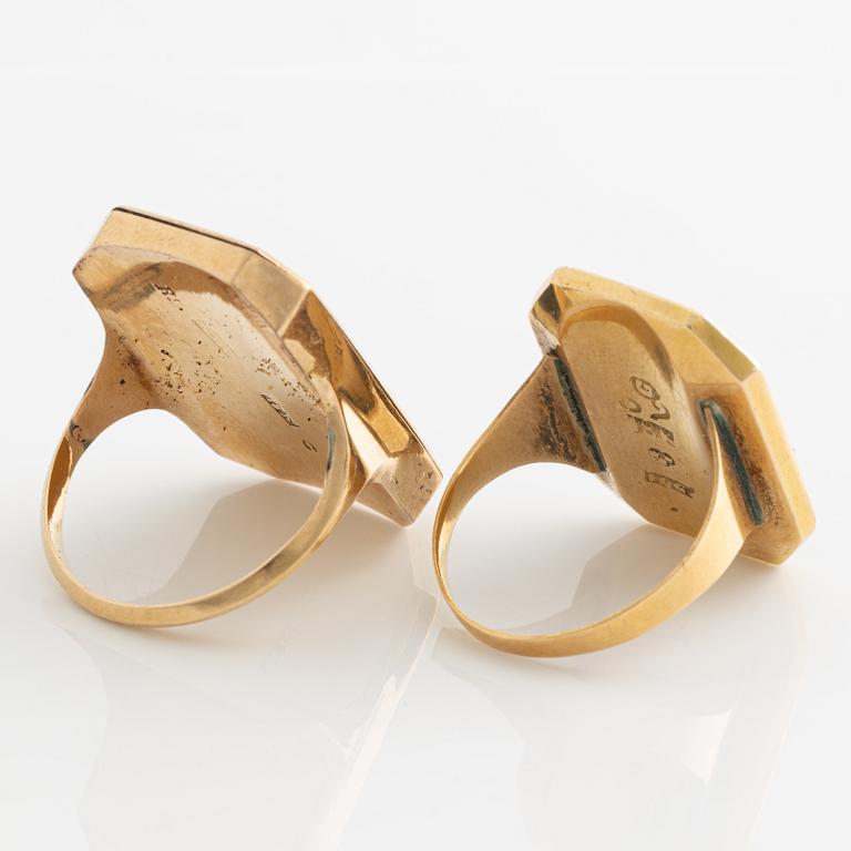 Rings, silhouette rings, a pair, gold with silhouette.