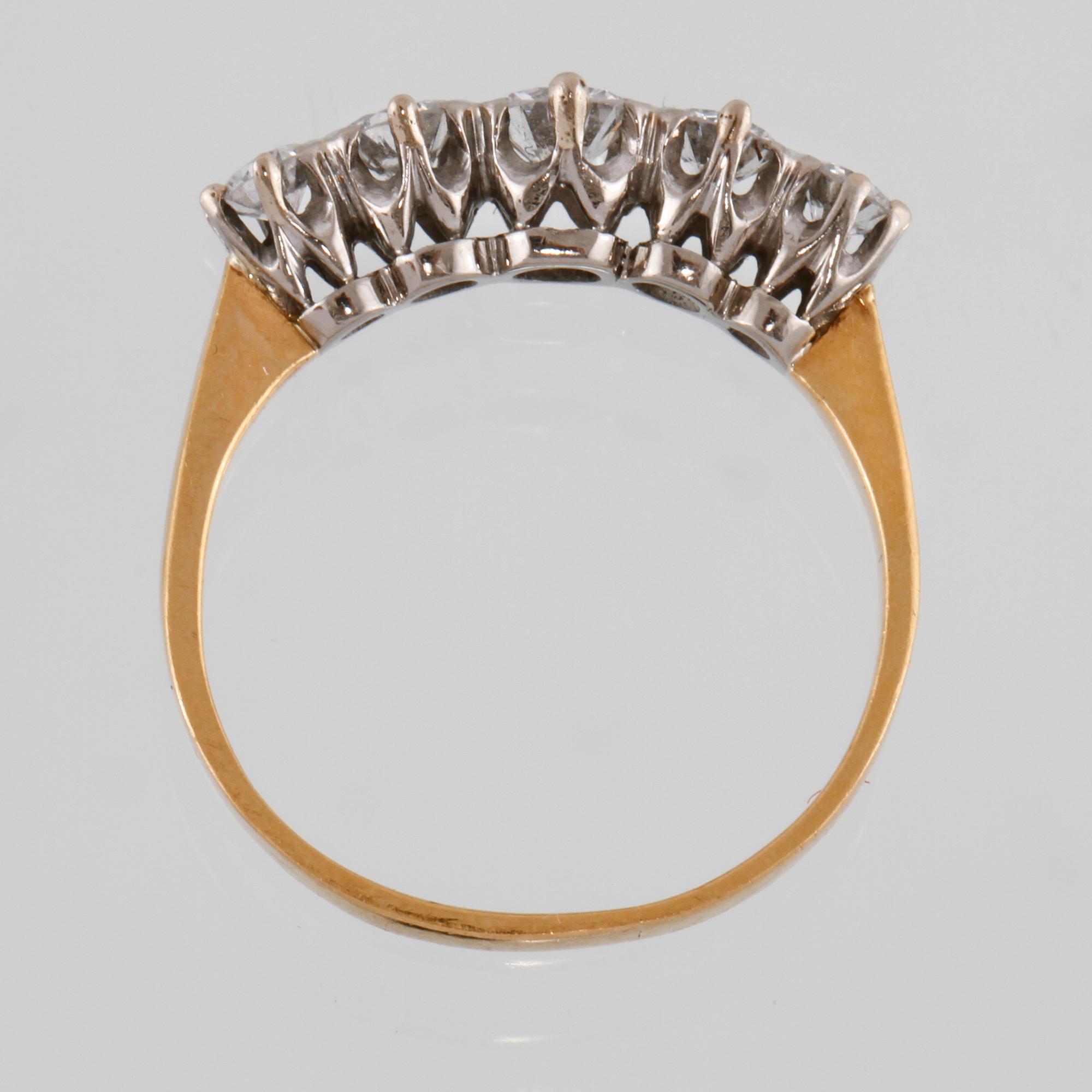 RING, 23K guld med 5 briljantslipade diamanter 0.71 ct. Vikt 2,6 gram.