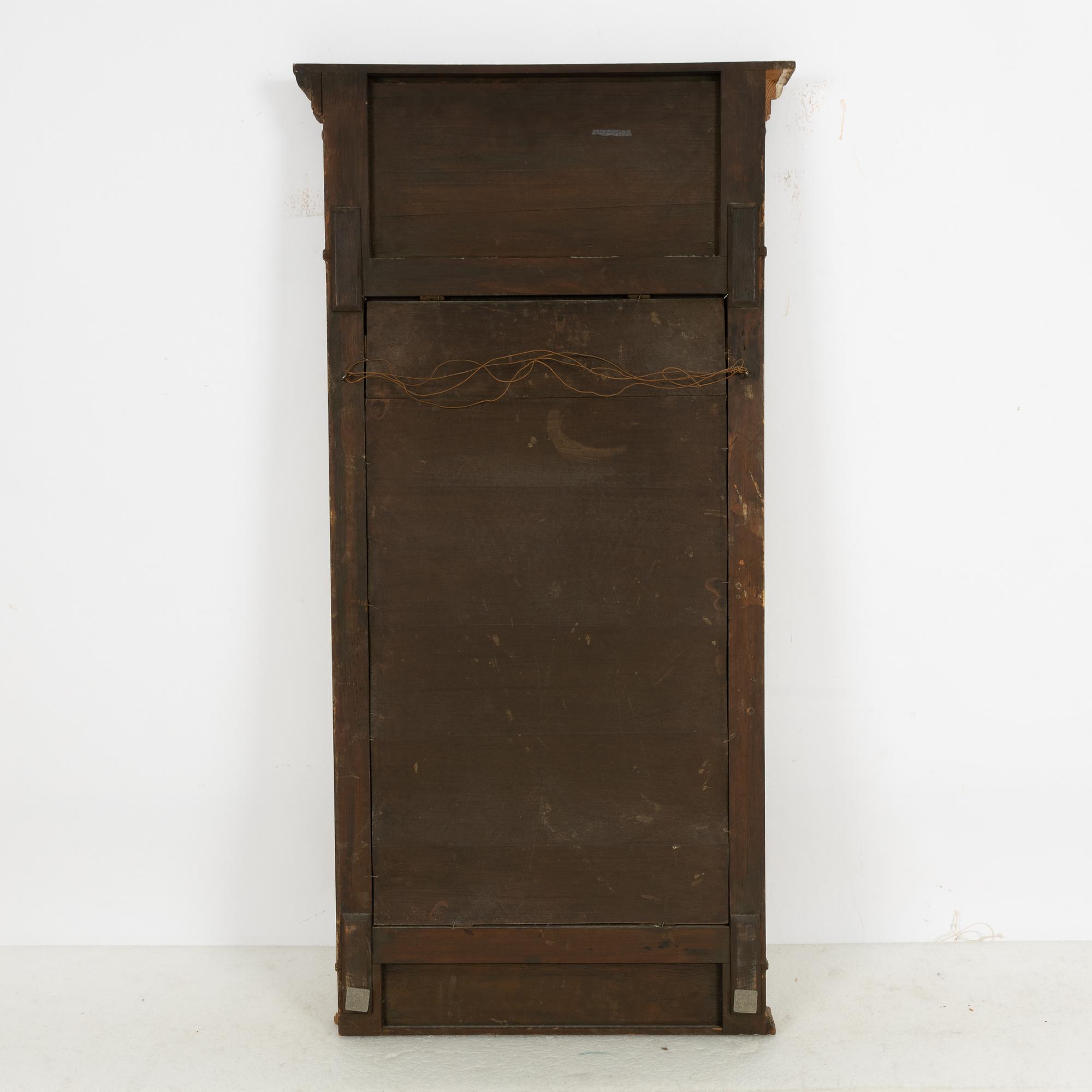 A Gustavian style mirror, circa 1900.