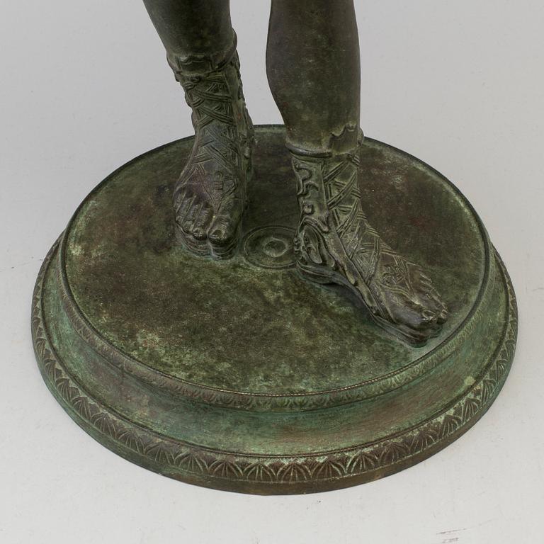 A 20th century bronze sculpture of Narcissus.