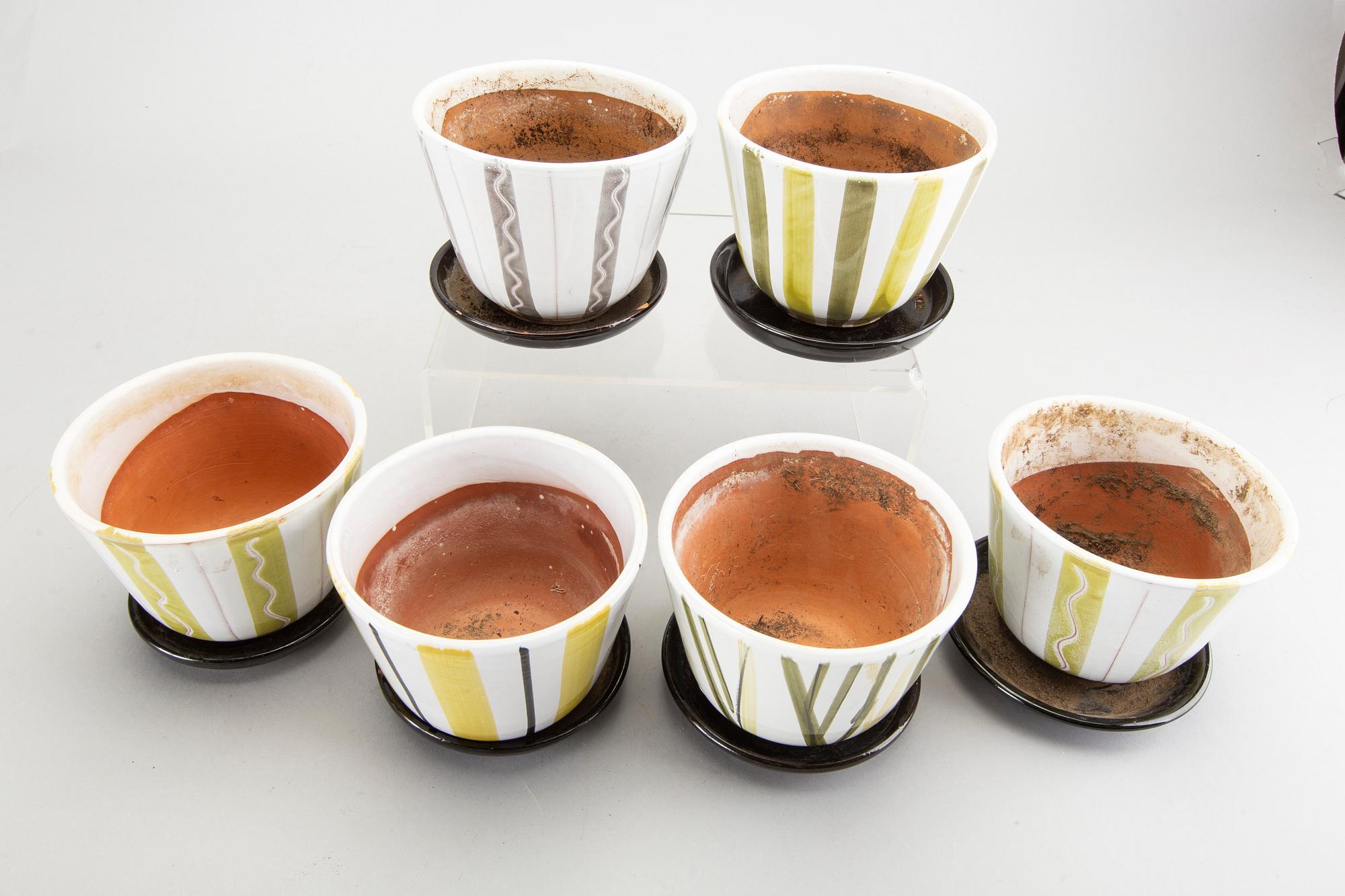 A set of six glazed ceramic flower pots, possibly by Upsala-Ekeby, 1940/50's.