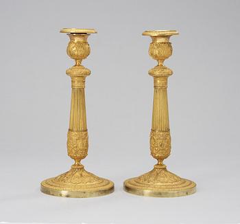 191. A pair of French Empire 19th century candlesticks.