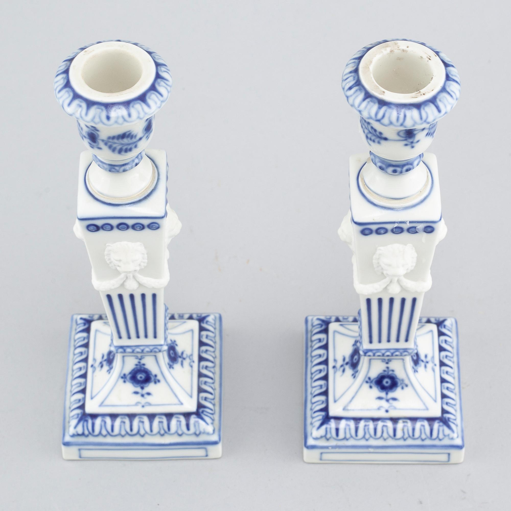 A pair of "Musselmalet" candlesticks in porcelain, by Royal Copenhagen, second half of the 20th century.