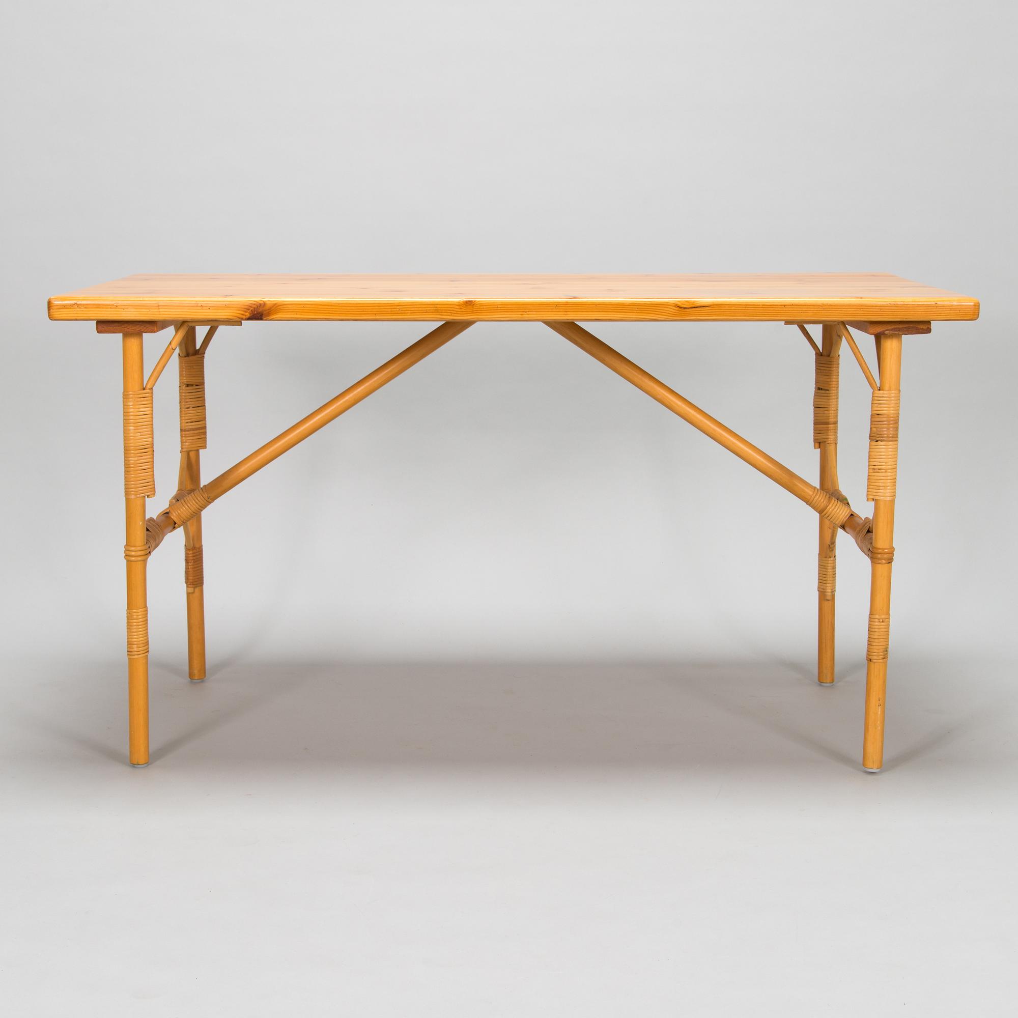 A pine wood and rattan table, late 20th century.