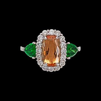 271. A topas, 2.95 cts, tsavorite and brilliant cut diamond ring, tot. 0.55 cts.