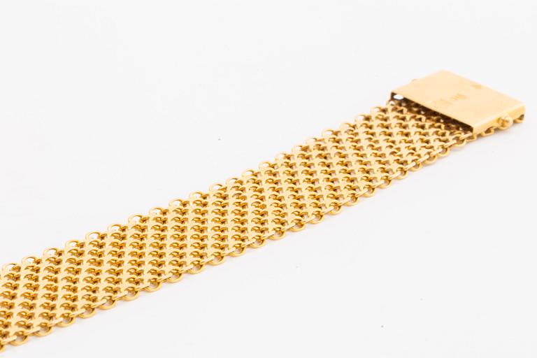 ARMBAND 18K guld bred x-länk, 48,5 g, Ädelsmycken AB Stockholm 1963.