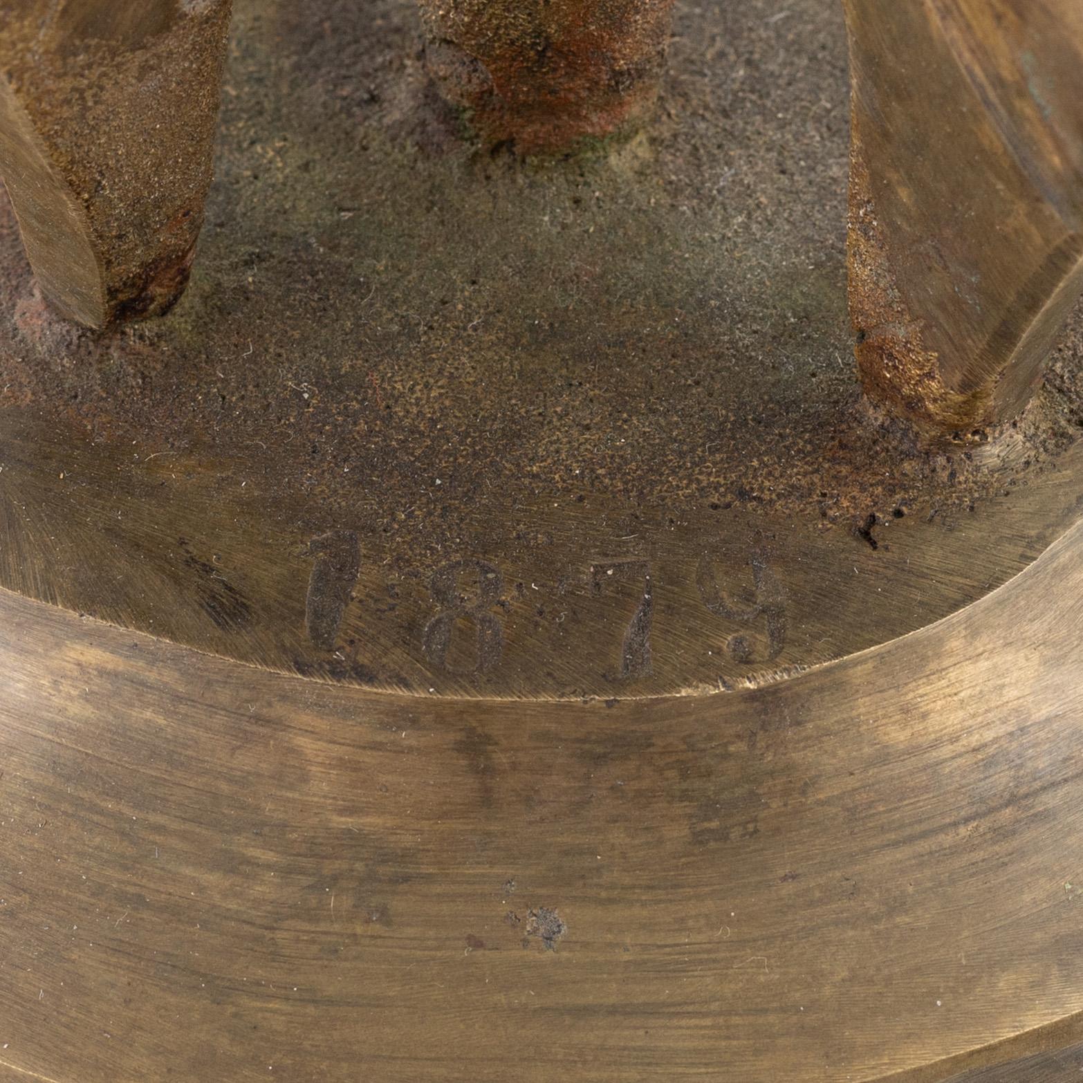 Vällingklocka, mässing, daterad 1879.