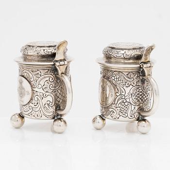 A pair of silver salt and mustard tankard,  C.G. Hallberg, Stockholm 1911 and 1914.