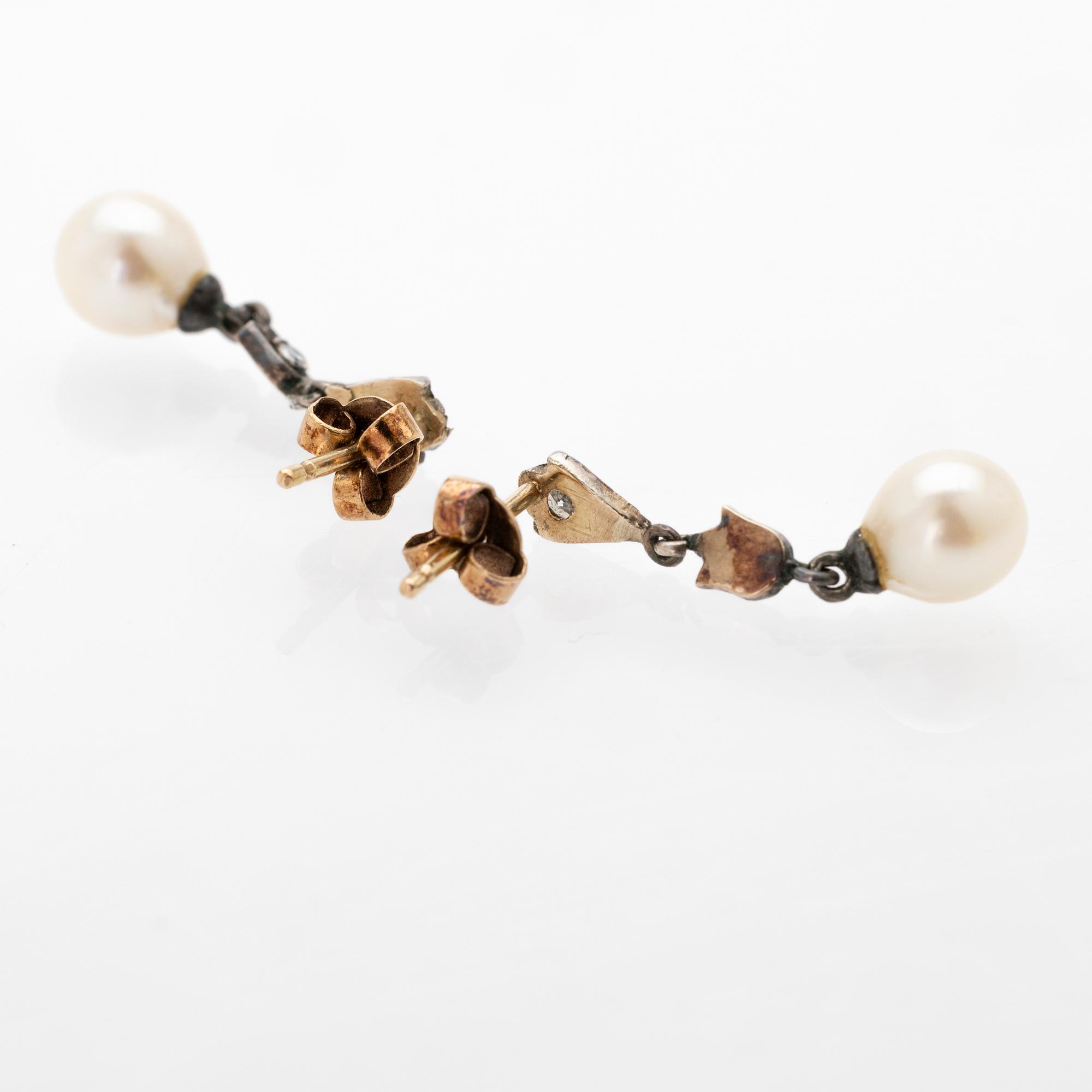 Earrings, a pair, 18K gold and silver with diamonds and cultured pearls.