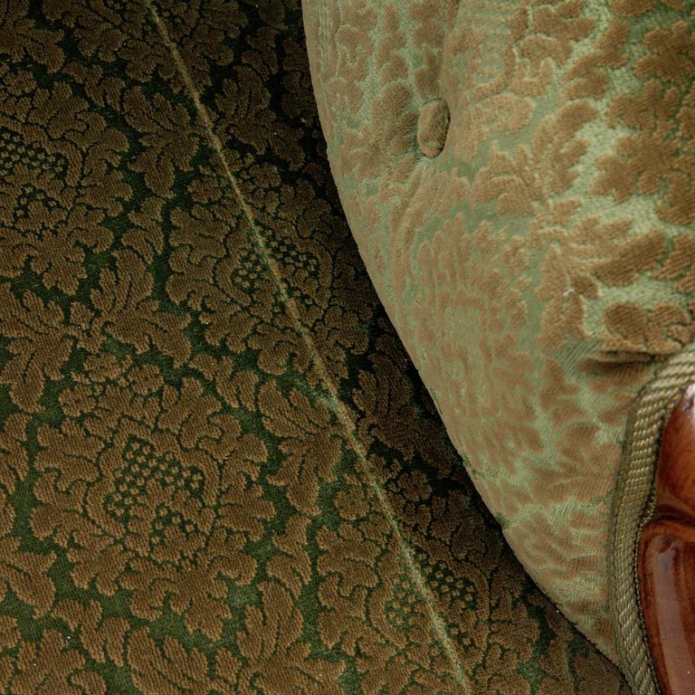 A rococo style sofa, four chairs and a table, second half of the 19th Century.