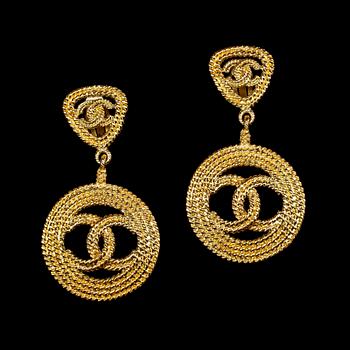 A pair of earclips by Chanel.