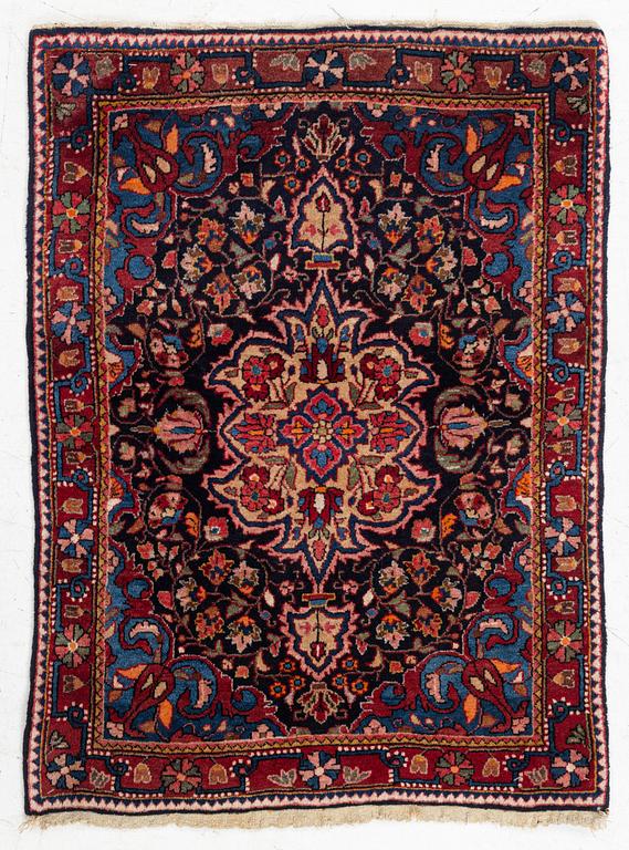 A Sarouk/Jozan rug, c. 86 x 64 cm.
