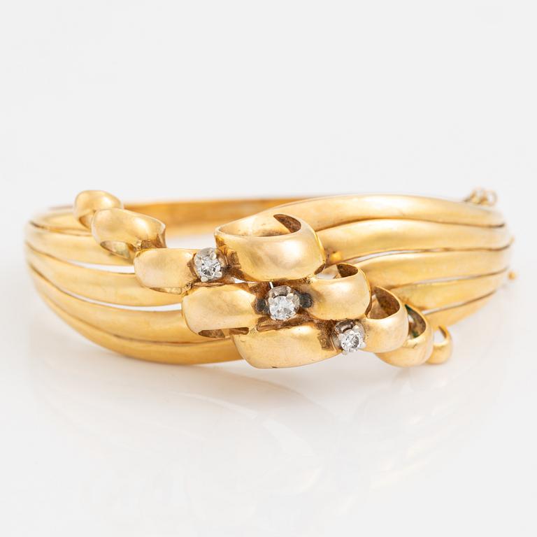 Brilliant cut diamond gold bangle.