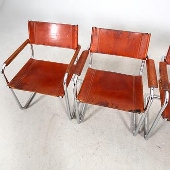 A matched set of four Matteo Grassi chrome and leather armchairs, late 20th Century.