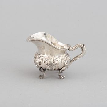 A silver teapot, creamer and sugar bowl, swedish import mark.
