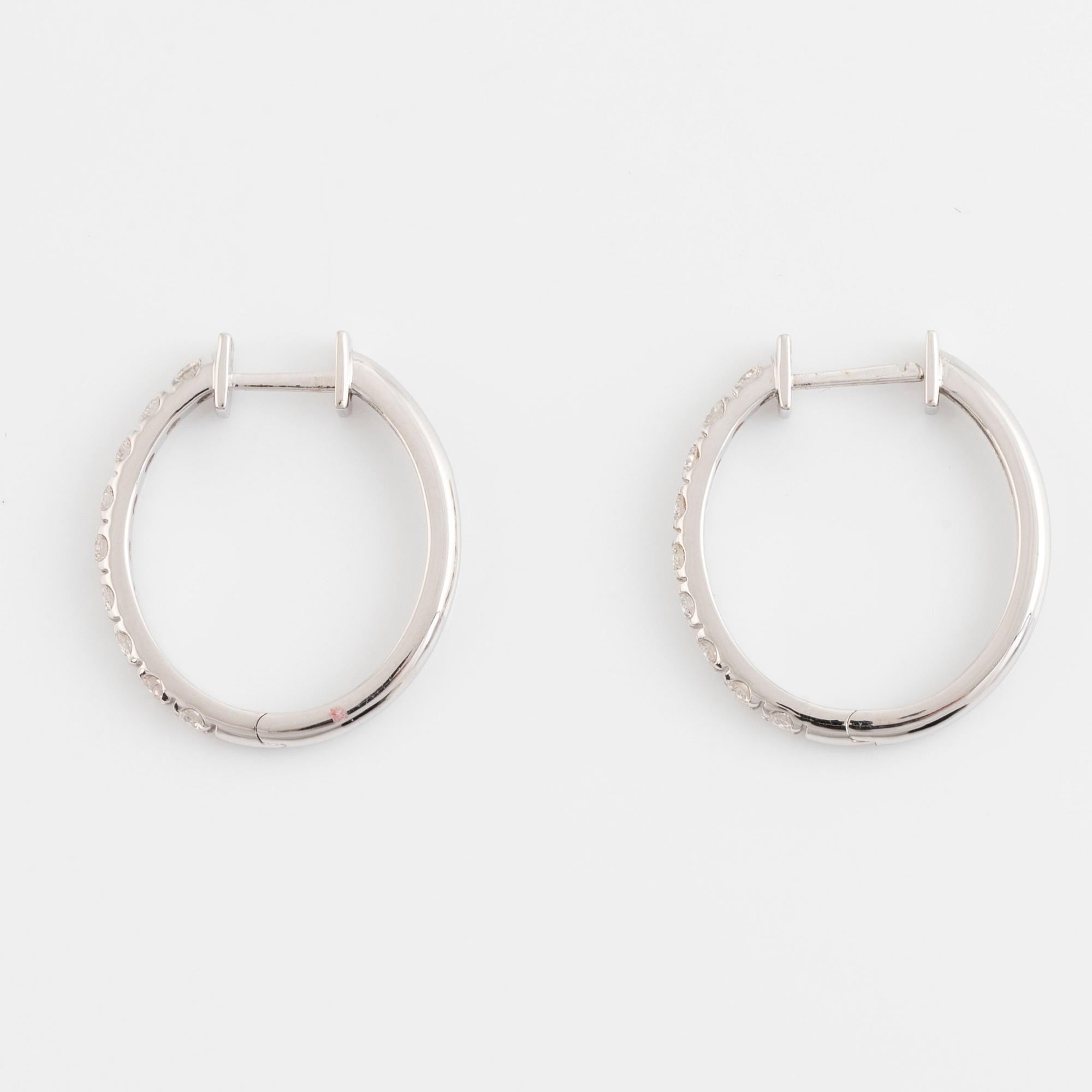Brilliant cut diamond hoop earrings.