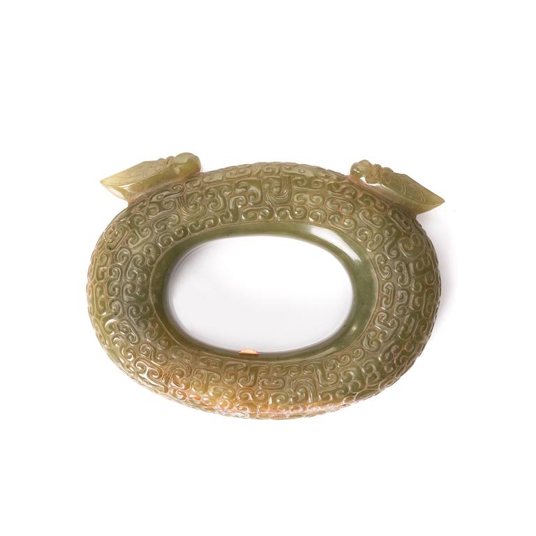 An archaistic sculptured nephrite ring with two cikadas.