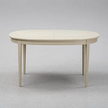 A dining table with two armchairs and six chairs by Carl Malmsten for Bodafors.