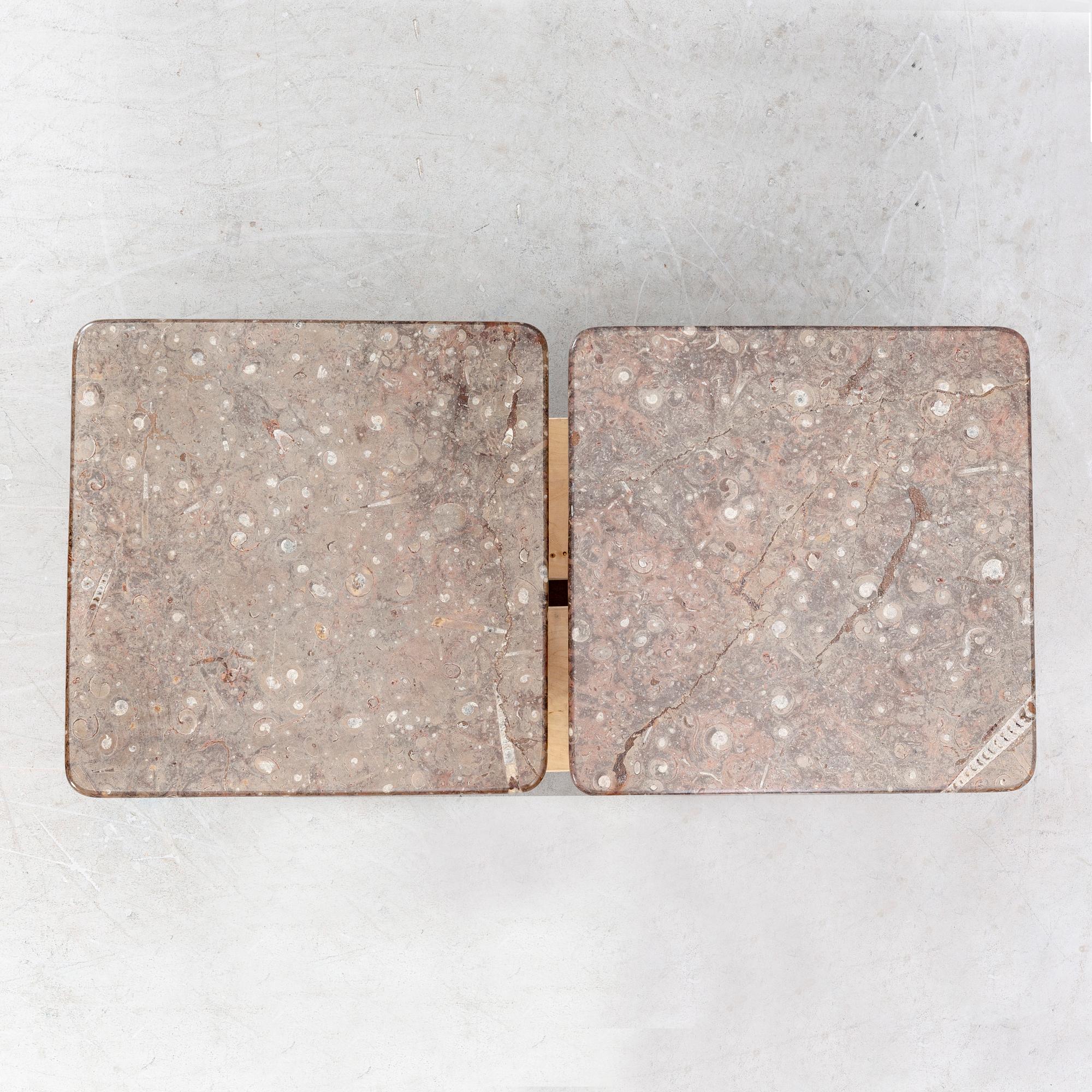 A set of two stone side tables later part of the 20th century.