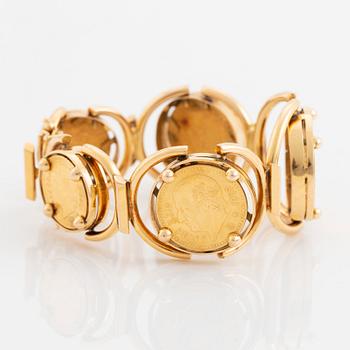 An 18K gold bracelet set with Mexican 22K gold coins.