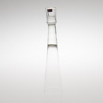 A GLASS CANDLESTICK, label marked Nuutajärvi Notsjö Boutique.