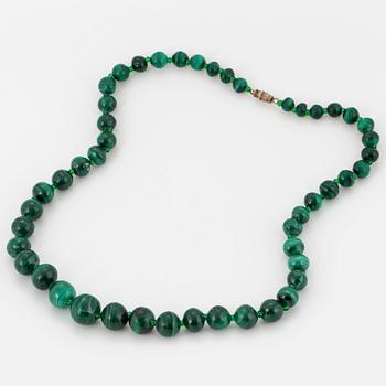 A malachite bead necklace.