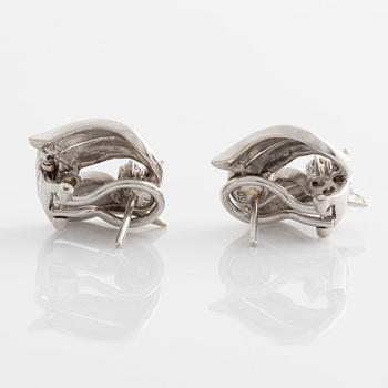 A pair of earrings in 18K white gold with round brilliant-cut diamonds.