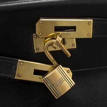 HERMÈS, a black leather 'Kelly' bag, 1970.