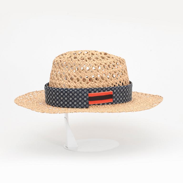 PRADA, a straw hat.