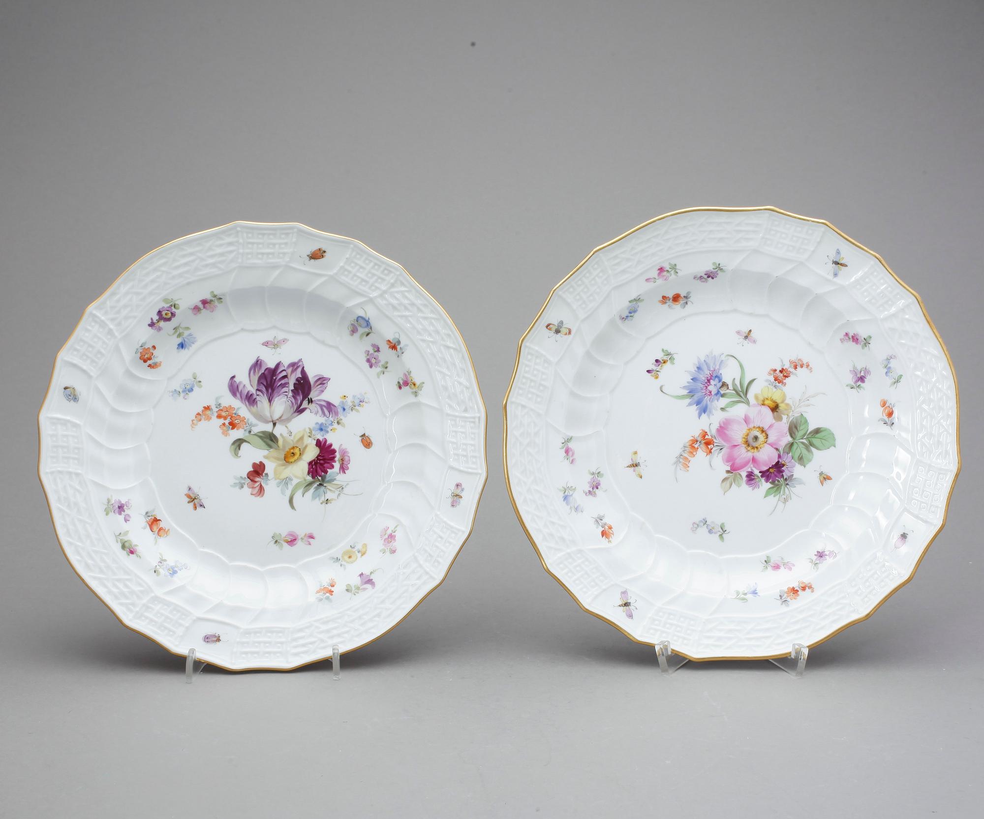 A pair of Meissen dinner plates, "Scattered flowers" with Kaiser Wilhelm II's monogram, dated 1894 and 1897.