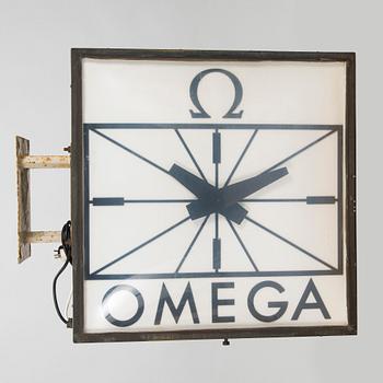Reklamklocka, Omega, 1900-talets andra hälft.