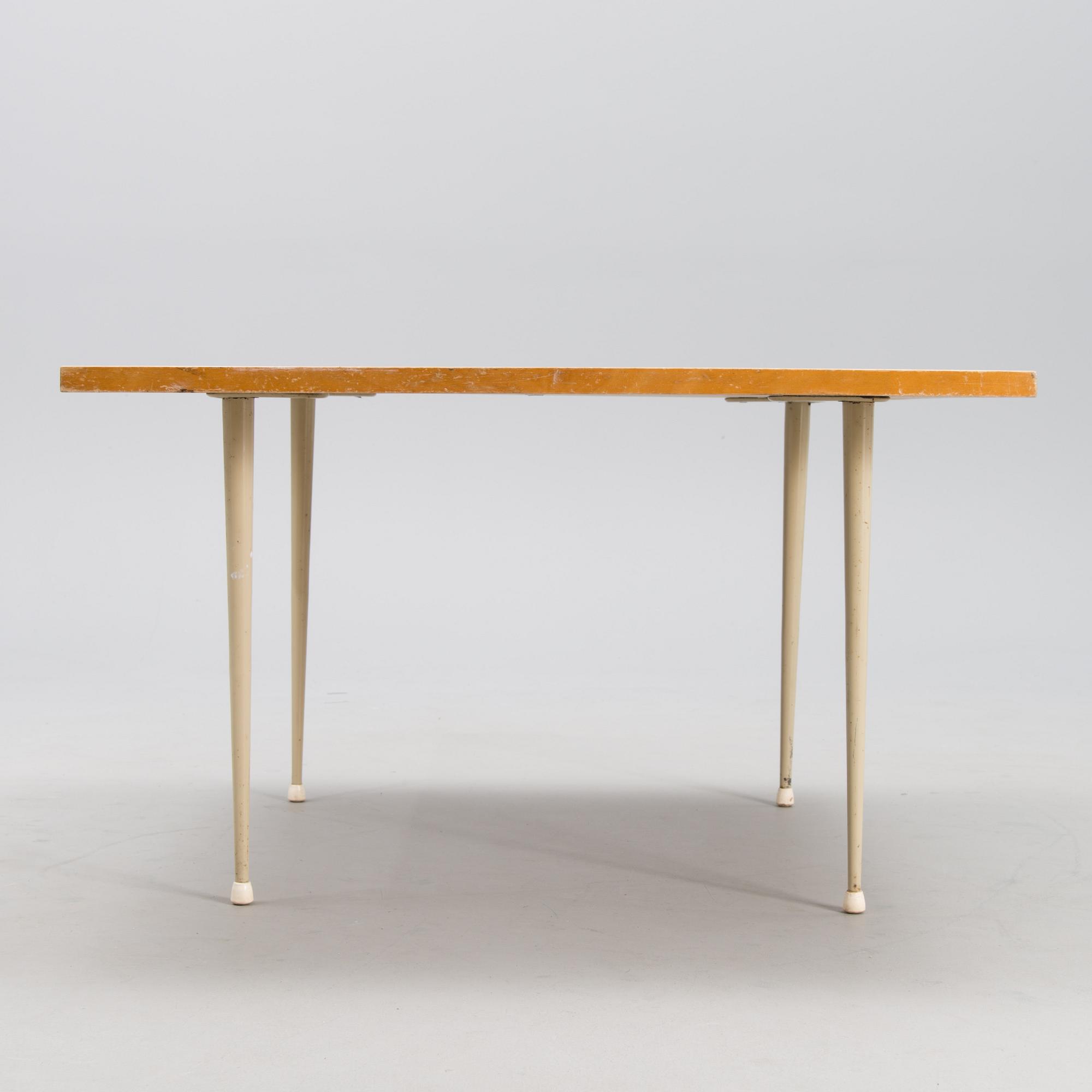 A coffee table marked Tapio Wirkkala, Asko, Made in Finland.