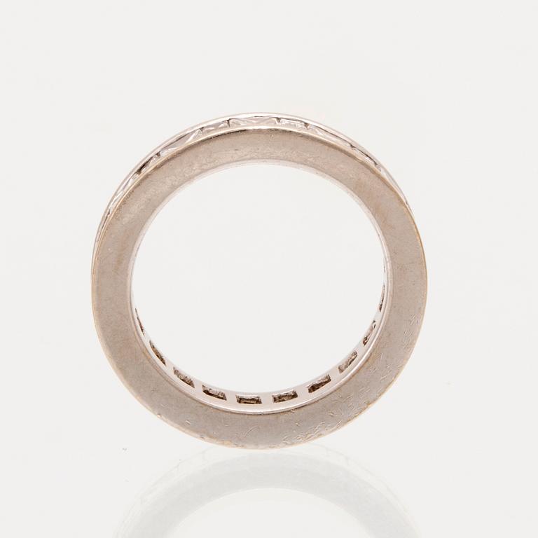 An 18K white gold eternity ring set with baguette and princess cut diamonds by Hartmann's Denmark.