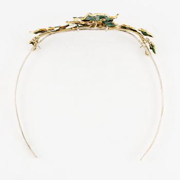 A necklace/tiara combination in 18K gold and green enamel set with old-cut diamonds.