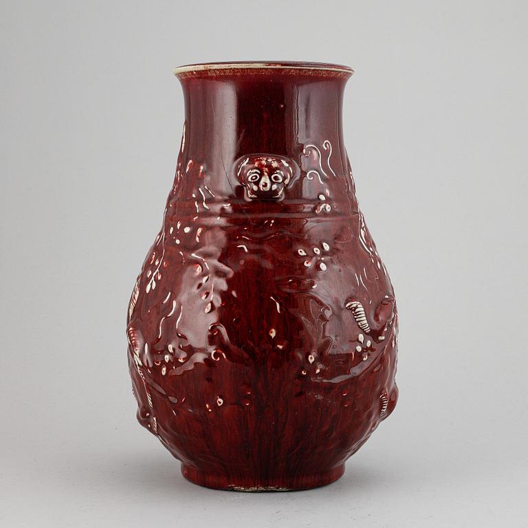A red glazed Chinese vase, 20th century.
