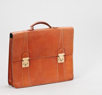 A 1990s natural cowhide leather brief case by Louis Vuitton.