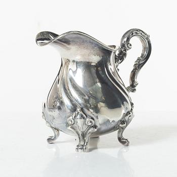 A Norwegian silver Rococo style coffee pot, cream jug, and sugar bowl, Norsk Filigransfabrikk, Oslo circa 1920.